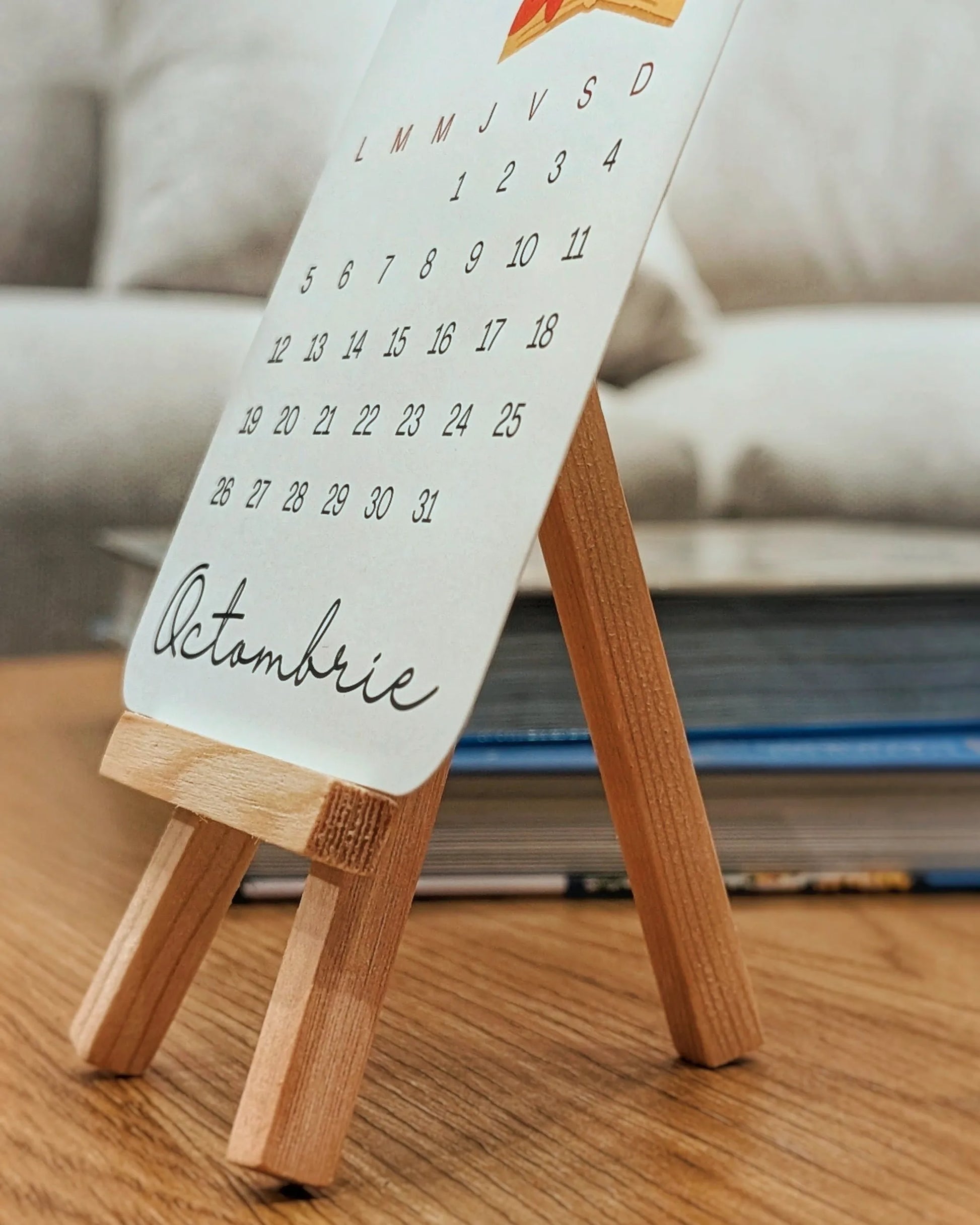 Small readers calendar on a wooden stand 2026